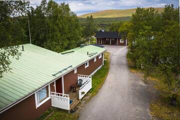 Фото номера Апартаменты с сауной (6 взрослых) Курортные отели Holiday Village Nuorgamin Lomakeskus г. Нуоргам 2